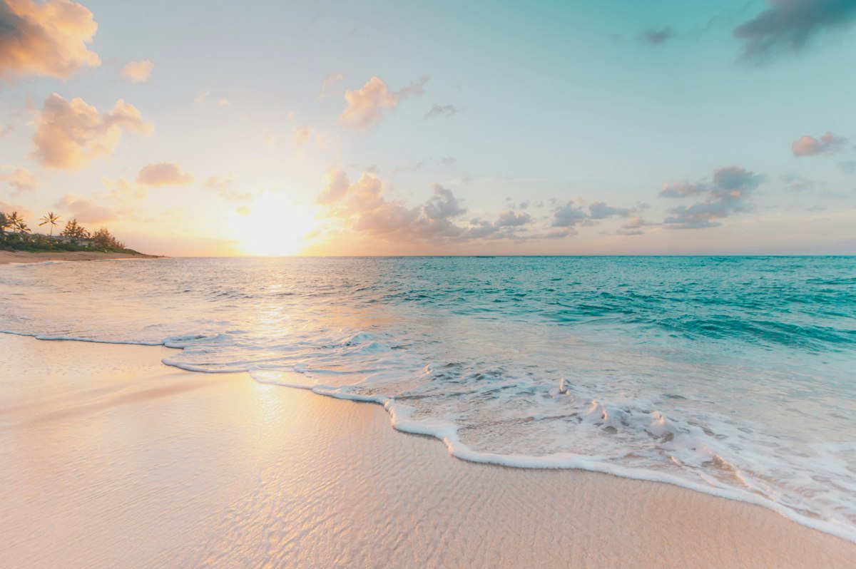 Sunset at a beach with people in the background
